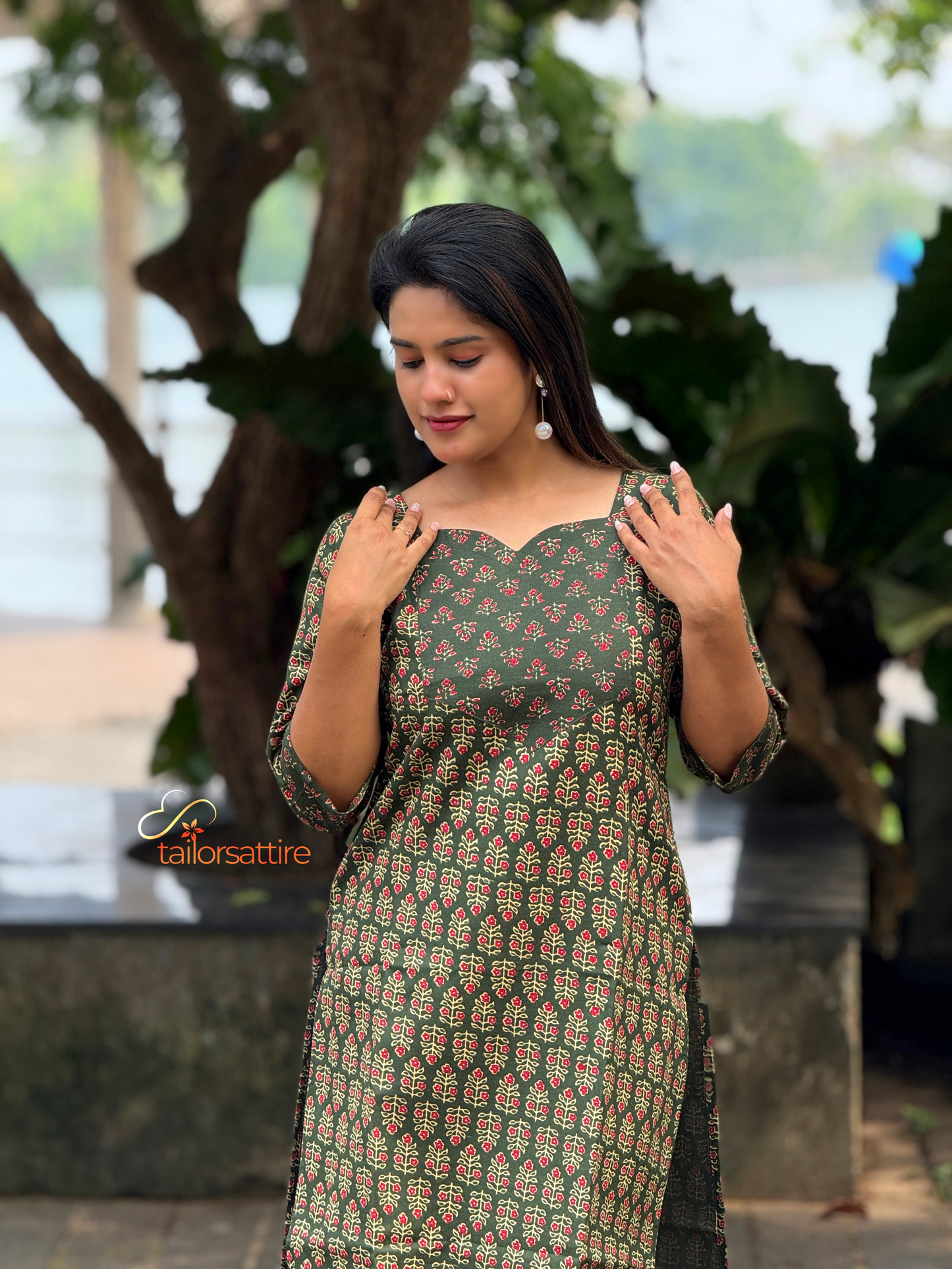 Green Polycotton Kurti With Elegant Red and Cream Patterns