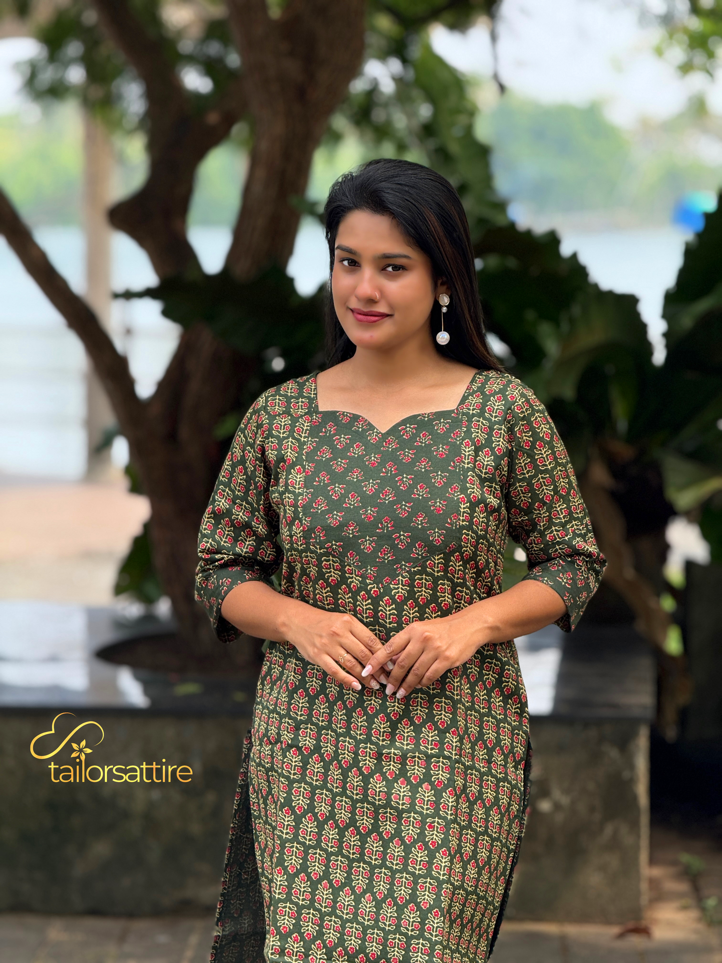 Green Polycotton Kurti With Elegant Red and Cream Patterns